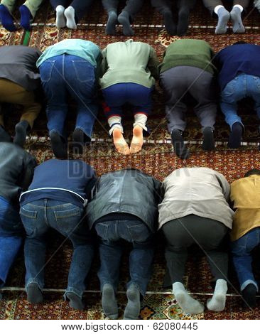 NOVI PAZAR, SERBIA - APRIL 28: Muslim men pray in the southern Serbian city of Novi Pazar, near the borders of Montenegro, Kosovo and Bosnia, worship at a local mosque on April 28, 2002 in Novi Pazar, Serbia.