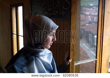 NOVI PAZAR, SERBIA - APRIL 28: A Muslim woman in the southern Serbian city of Novi Pazar, near the borders of Montenegro, Kosovo and Bosnia, prepares for worship at a local mosque on April 28, 2002 in Novi Pazar, Serbia.