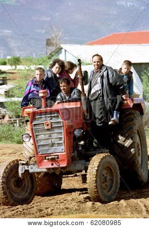 KUKES, ALBANIA - APRIL 17: An ethnic Albanian Kosovar family arrives at a refugee camp along the Kosovo border. The family had been driven from their home in Kosovo by Serbian security forces on April 17, 1999 in Kukes, Albania