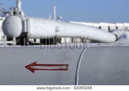 ROYARKA, UKRAINE - JAN: 13: An arrow painted on a gas pipeline from Russia points towards Ukraine as it emerges from the ground on its way to Europe at a pumping station in Boyarka, Ukraine, on Tuesday, January 13, 2009.
