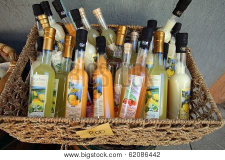 MANAROLA - ITALY: AUG 17: Bottles of local fruit liquor on display in Manarola, Italy, on Sunday, August 17, 2013. The village is one of five towns of Cinque Terre. 