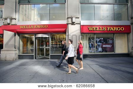 NEW YORK CITY - OCT 24 2013:  Pedestrians walk past a branch office of Wells Fargo & Company bank in Manhattan on Sunday, October 20, 2013. 