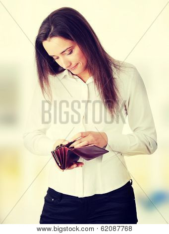 Young caucasian woman with empty wallet - broke