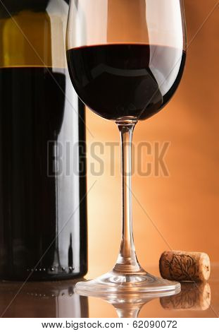 A bottle of wine and two glasses