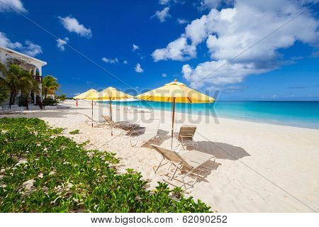 Chairs and umbrella on a beautiful tropical beach at Anguilla, Caribbean