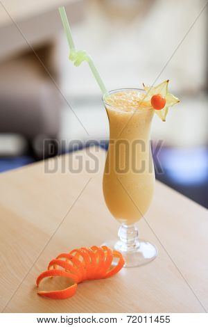 Milk cocktail with orange and carom
