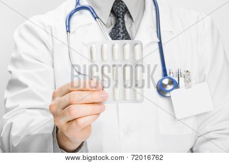 Doctor Holdling Pills In His Hand - Heath Care Concept