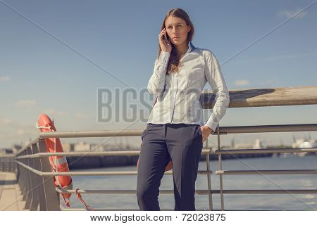 Woman Standing Talking On A Mobile