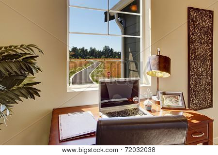 Office Area In Bright Living Room With Window