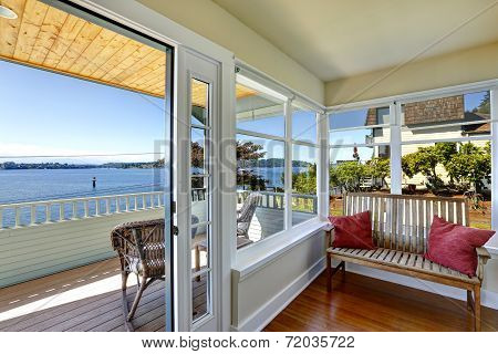 Sun Room And Walkout Deck. American Architecture. Real Estate With Water Front View.