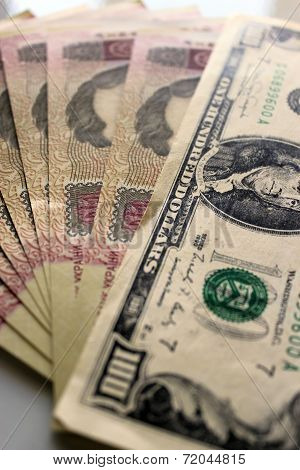 A Hundred Dollars Laying On The Ukrainian Grivnas
