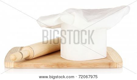 Chef's hat with spoon and battledore isolated on white