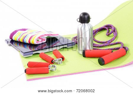 Sport requisites on a carpet isolated on white