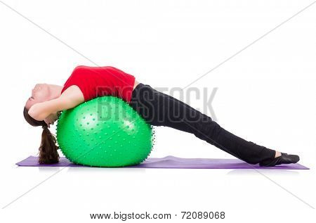 Young woman exercising with swiss ball