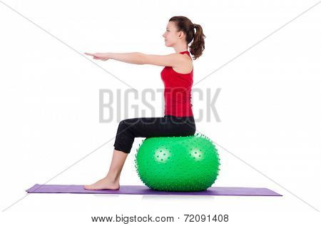 Young woman exercising with swiss ball