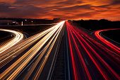 Speed Traffic - light trails on motorway highway at night,  long exposure abstract urban background