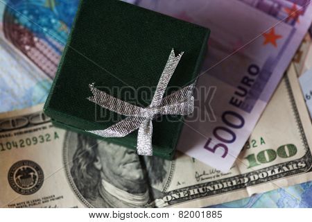 present box and money - dollar and euro