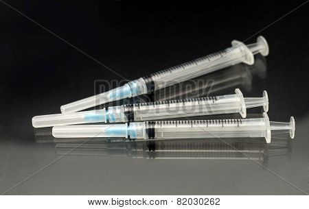 Three medical syringes
