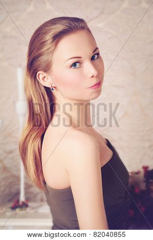 Portrait of Beautiful Young Woman looking at Camera.