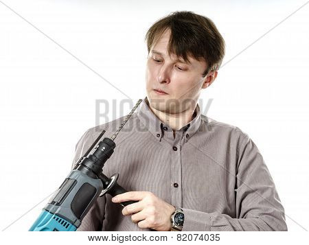 Young Man With Electric Drilling Machine Isolated On White
