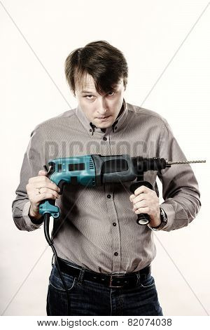 Young Man With Electric Drilling Machine Isolated On White