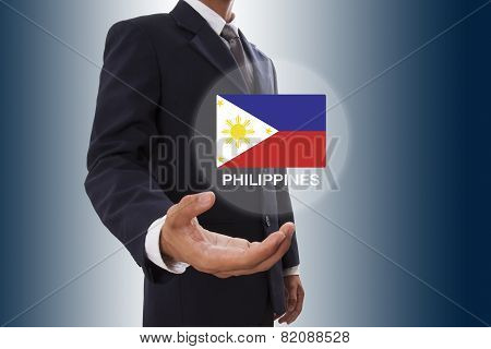 Businessman hand showing Philippines Flag