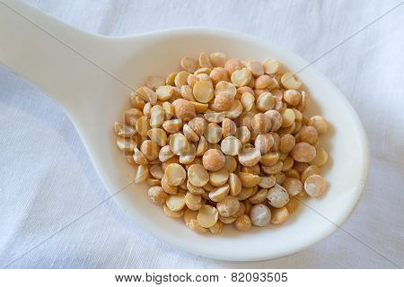 Yellow Peas On A White Spoon