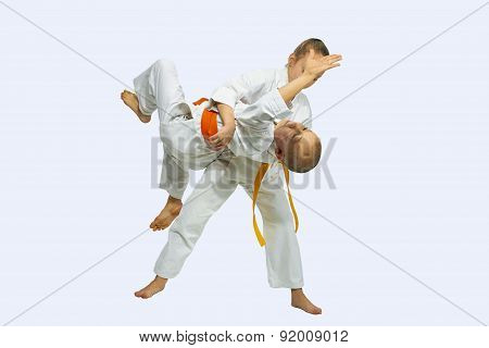 Throw the Judo is doing girl in karategi