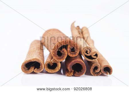 Group Of Dried Cinnamon Stics On White Background