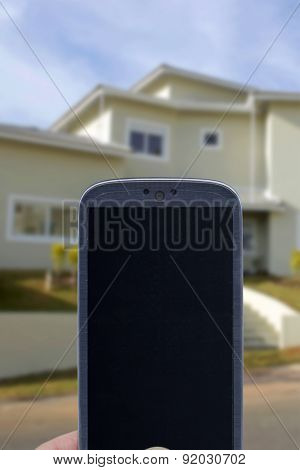 Smatrphone and house. Idea for smartphone home security system, monitoring system, real state applications, contractor, architecture, home improvements,  and others.