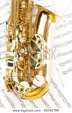 View of shiny golden alto saxophone bow part