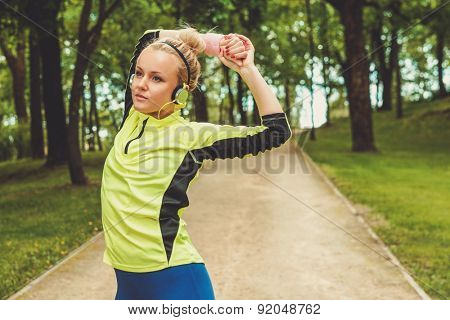 Woman doing stretching exercise before running 
