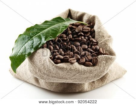 Sack Full Of Coffee Beans On White With Green Leaf