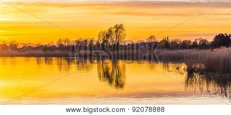 Sunset In Zinnowitz With Reflection On The Water