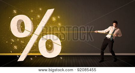 Business man pulling rope with big procent symbol sign concept on background