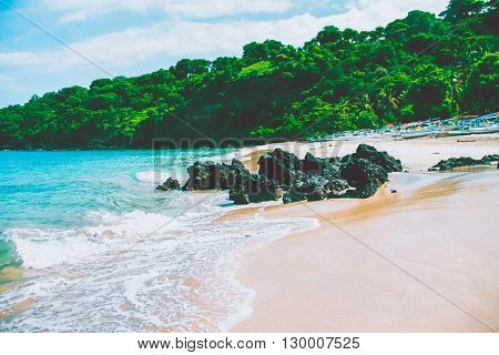 Beautiful beach, clear water of Indian ocean at sunny day. Bali, Indonesia