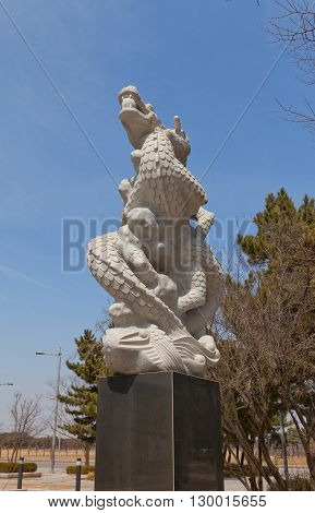 SEOUL SOUTH KOREA - MARCH 23 2016: Sculpture of a dragon (2002) the Biryong Cadastral Triangulation Station in Seoul Korea. The starting spot of construction of Incheon International Airport