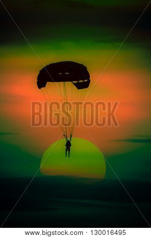 parasailing parachute on sunset at Pattaya beach Thailand