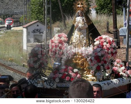 Alora Spain 24 April 2016: Religious procession crossing railway line near Alora Andalucia. Alora Spain 24 April 2016
