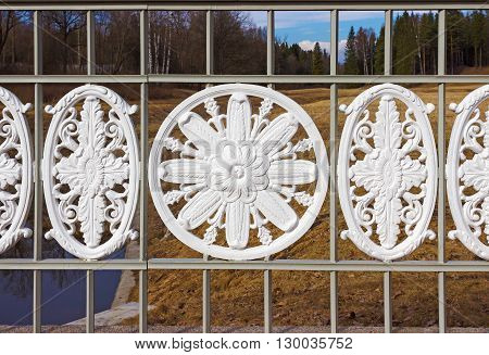 Ornamental fence of the bridge in Park of Pavlovsk. Saint Petersburg. Russia.