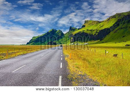 Circumferential highway around the island of Iceland. Mountains and green meadows