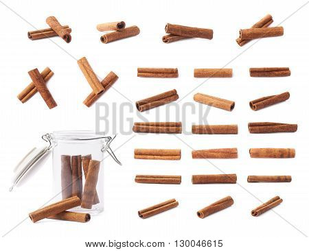 Set of different cinnamon sticks compositions isolated over the white background