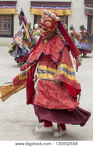 LAMAYURU INDIA - JUNE 13 2015: An unidentified buddhist lamas dressed in mystical mask dancing Tsam mystery dance in time of Yuru Kabgyat Buddhist festival at Lamayuru Gompa Ladakh North India