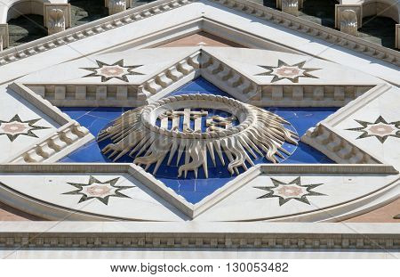 FLORENCE, ITALY - JUNE 05: IHS sign, Basilica di Santa Croce (Basilica of the Holy Cross) - famous Franciscan church in Florence, Italy, on June 05, 2015