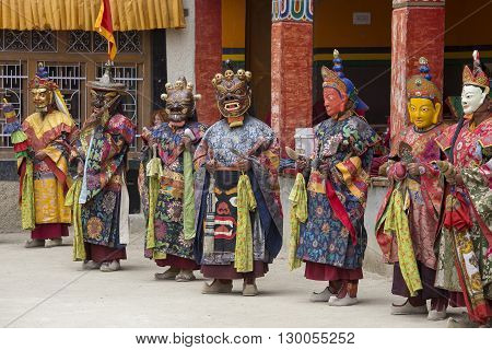 LAMAYURU INDIA - JUNE 13 2015: An unidentified buddhist lamas dressed in mystical mask dancing Tsam mystery dance in time of Yuru Kabgyat Buddhist festival at Lamayuru Gompa Ladakh North India
