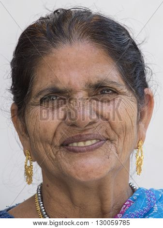 RISHIKESH INDIA - OCTOBER 20 2014 : Unidentified Indian woman visited a Buddhist temple in the holy city of Rishikesh near the River Ganges