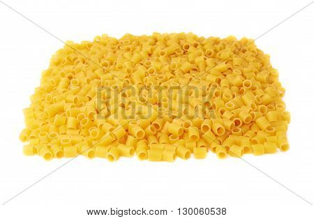 Pile of dry ditalini yellow pasta over isolated white background