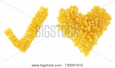 Yes tick sign symbol mark and heart shape made of dry ditalini yellow pasta over isolated white background