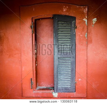 Antique wooden window of the red building at chanthaburi Thailand