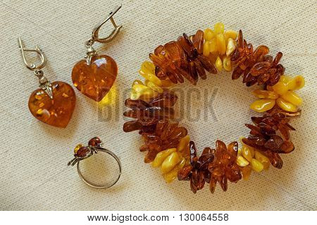 Amber Jewelry: bracelet earrings ring. Amber jewelry closeup.